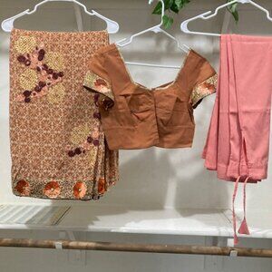 Peach embroidered sari with blouse.